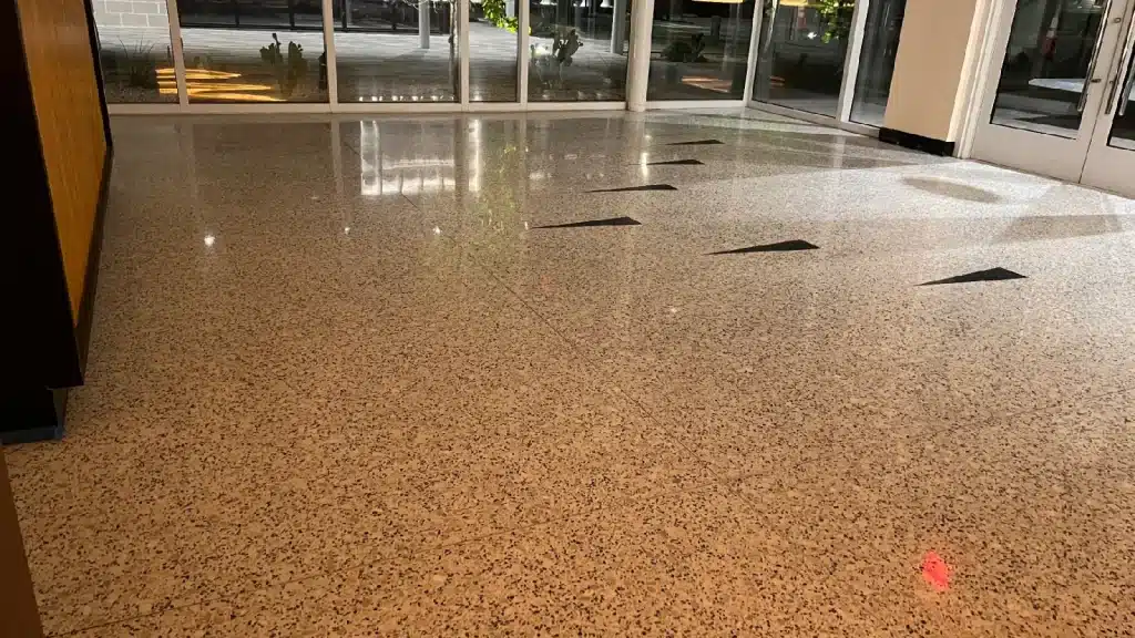 Commercial terrazzo floor entrance after restoration in Bellaire TX showing restored shine and clarity