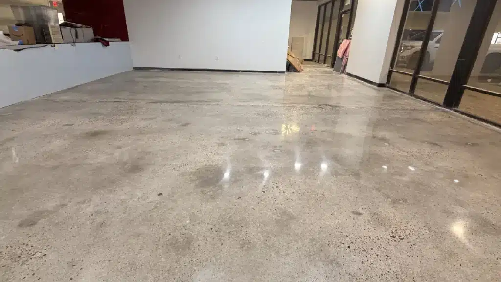 Polished concrete floor in Westchase Houston, TX finished to 800 grit with guard application showing enhanced reflectivity.