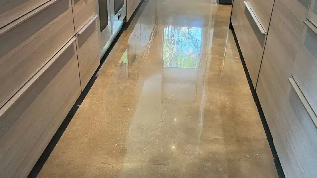 After concrete floor polishing in a residential kitchen showing uniform reflectivity and improved surface clarity.