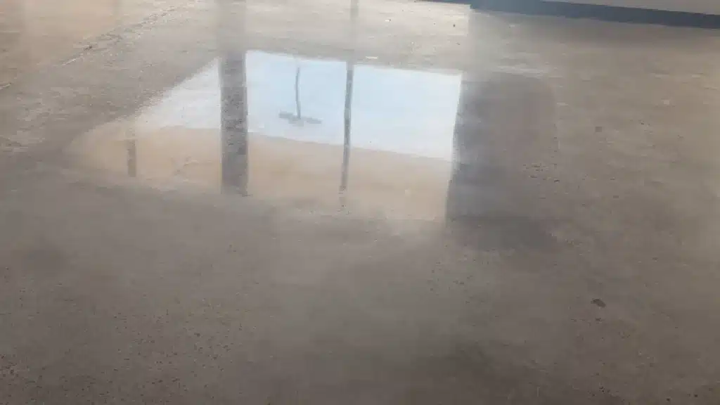Concrete floor test area showing guard application compared to untreated 800 grit surface in Westchase Houston, TX.