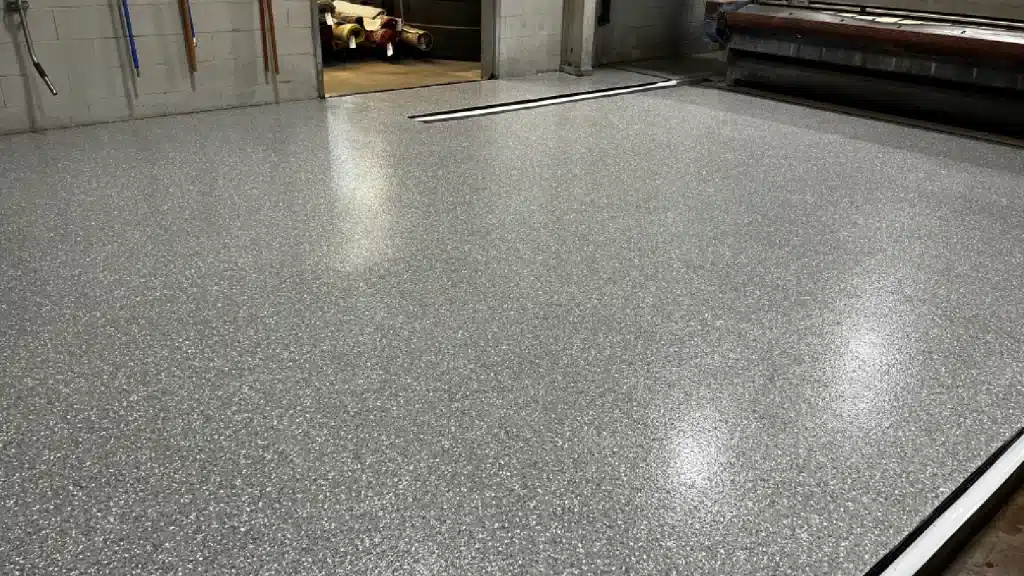 Commercial epoxy floor coating with flake system and polyaspartic topcoat in Tomball TX