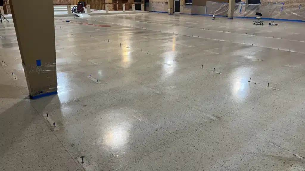 Terrazzo floor before restoration inside Immaculate Conception Church from a different angle in Goliad, TX