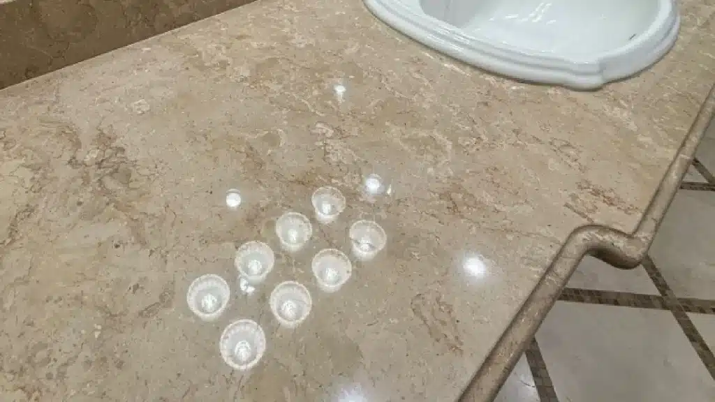 Marble countertop after restoration in Tomball TX showing restored clarity and high-gloss polished finish