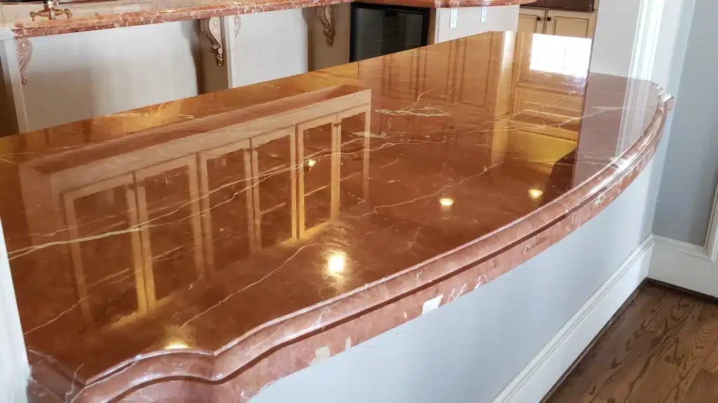 Wide view of restored marble kitchen countertops showing consistent polish across island and perimeter surfaces in Kemah, Texas.