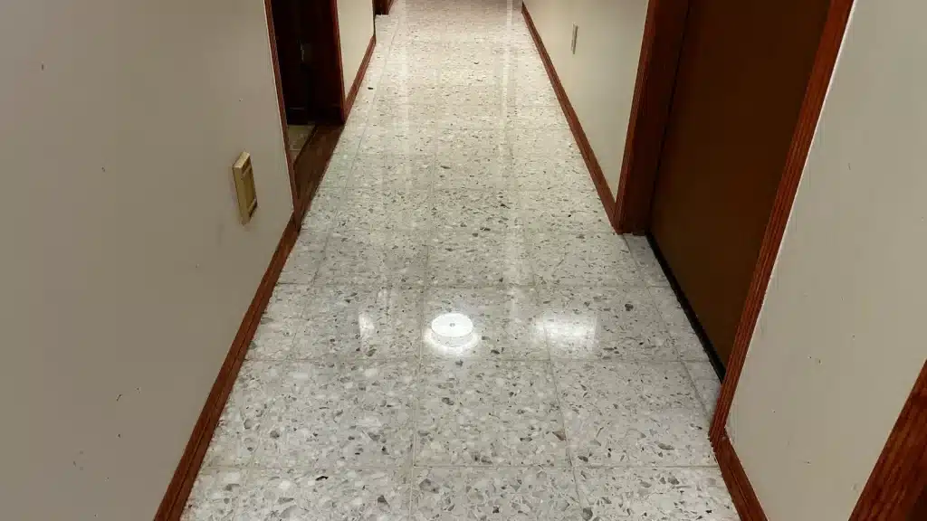 Restored terrazzo hallway floor with a smooth, high-gloss finish after professional restoration in Goliad, TX