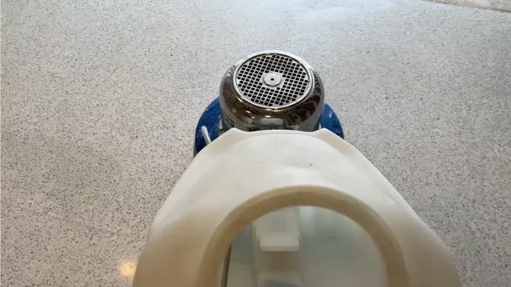 Terrazzo floor after structural repairs and grinding but before final polishing.
