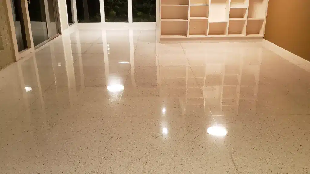 Terrazzo floor in living room near kitchen after semi-gloss restoration in Richmond TX