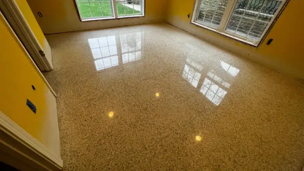 Terrazzo floor after full grinding, repair, and high-polish restoration in Lake Jackson TX