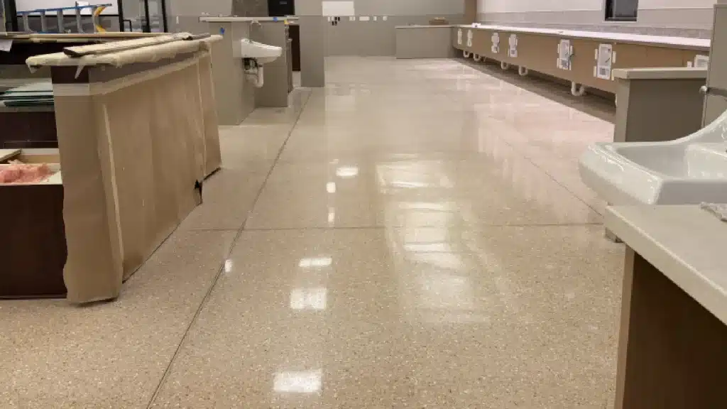 Epoxy terrazzo floor after restoration with uniform semi-gloss finish in Pearland TX medical facility