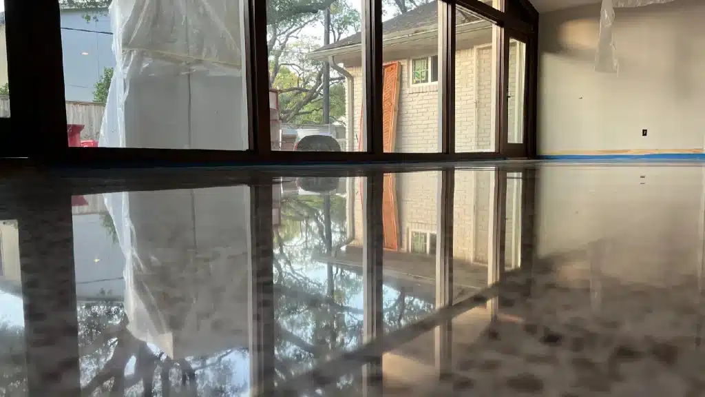 Wide view of terrazzo floor after stain removal and polishing with restored uniform gloss.