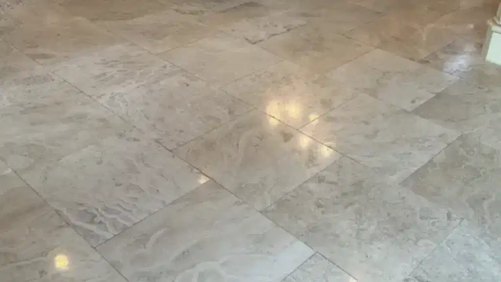 Travertine floor after crack repair and polishing completed in Humble, Texas.