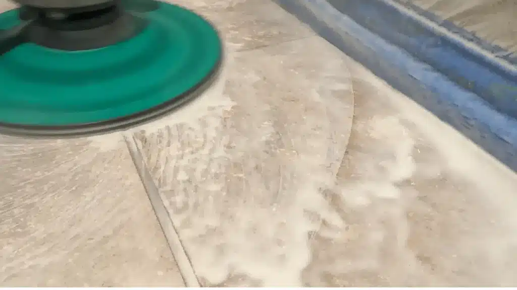 Travertine floor during grinding process to correct tile lippage in League City TX