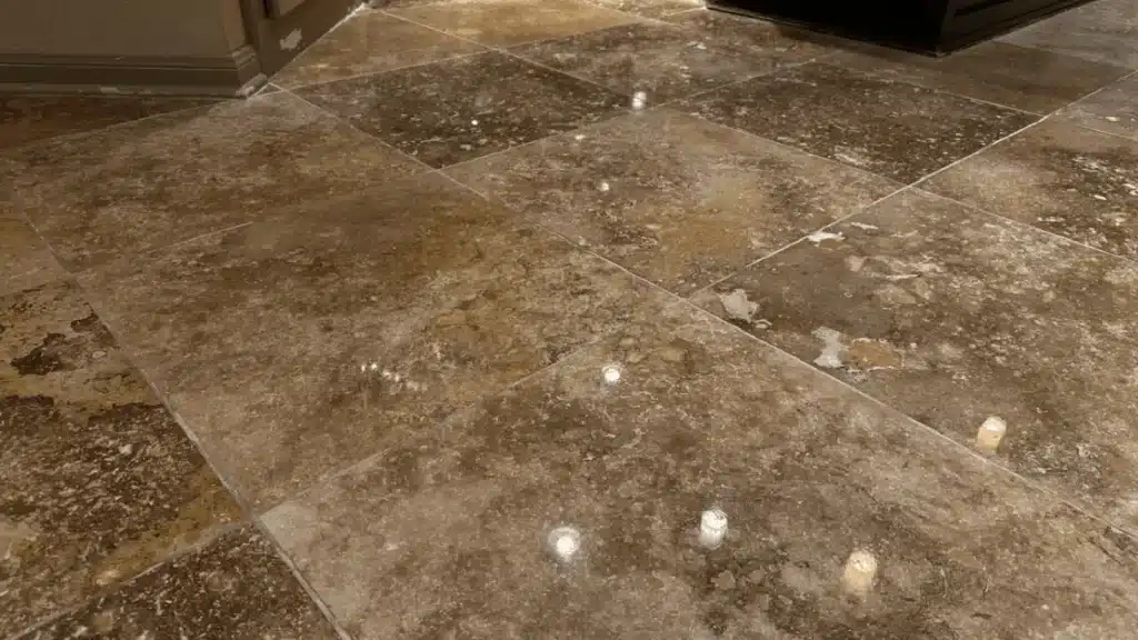 Travertine floor after lippage correction and high-polish restoration in League City TX