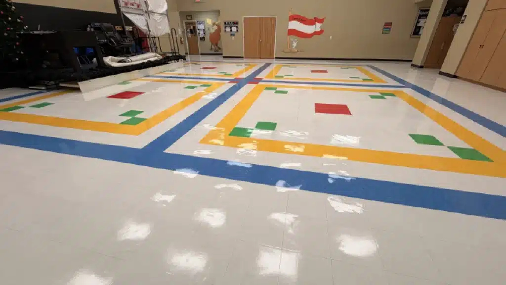 VCT floor after professional strip and wax service in a daycare gym
