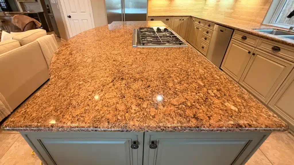Restored polished granite kitchen island countertop