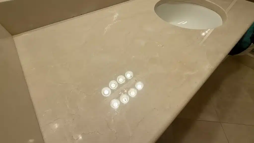 Well maintained natural stone bathroom vanity countertop with polished surface