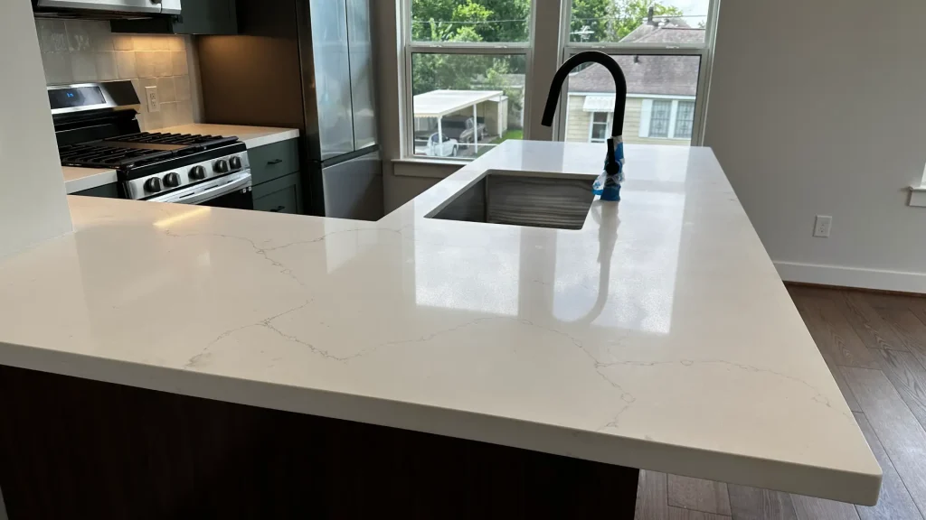 Well maintained veined quartz kitchen countertop with polished surface