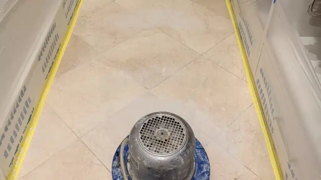 Marble floor honing process in Royal Oaks Houston Texas showing machine refining stone surface before polishing