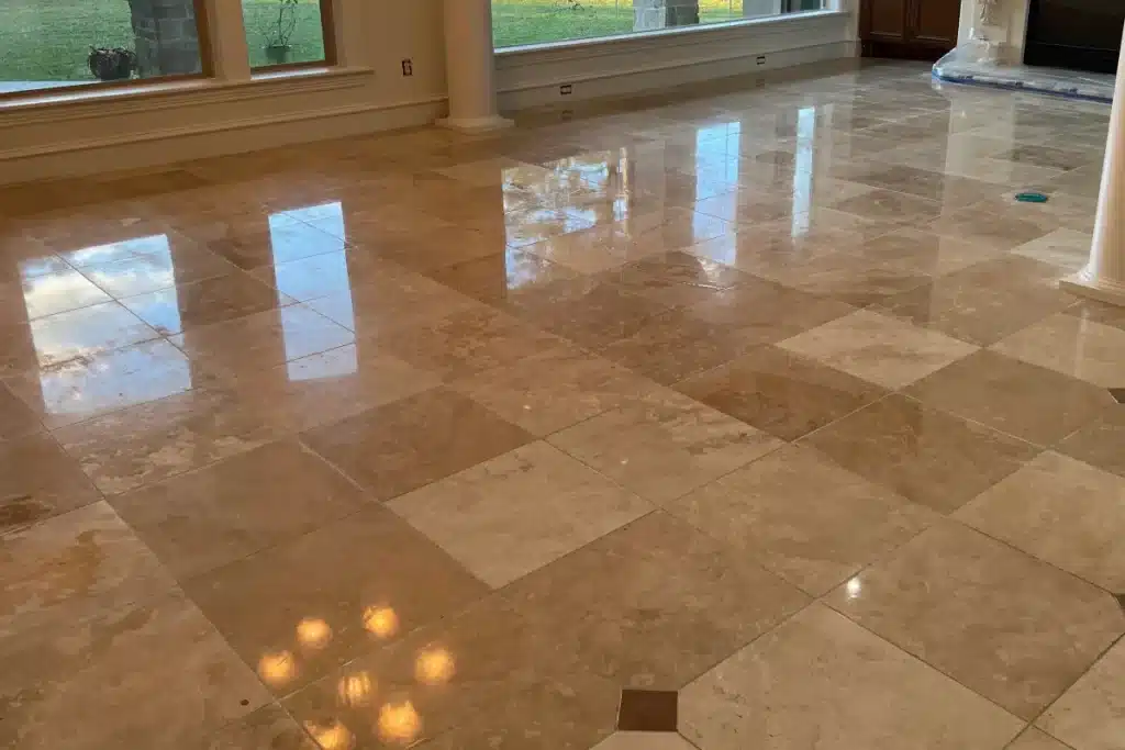 Polished travertine floor with a smooth, refined finish and natural light reflection