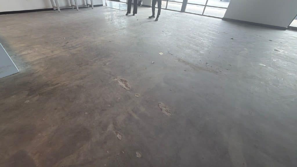 Polished Concrete Floor Before and After – Westchase Houston TX - Before
