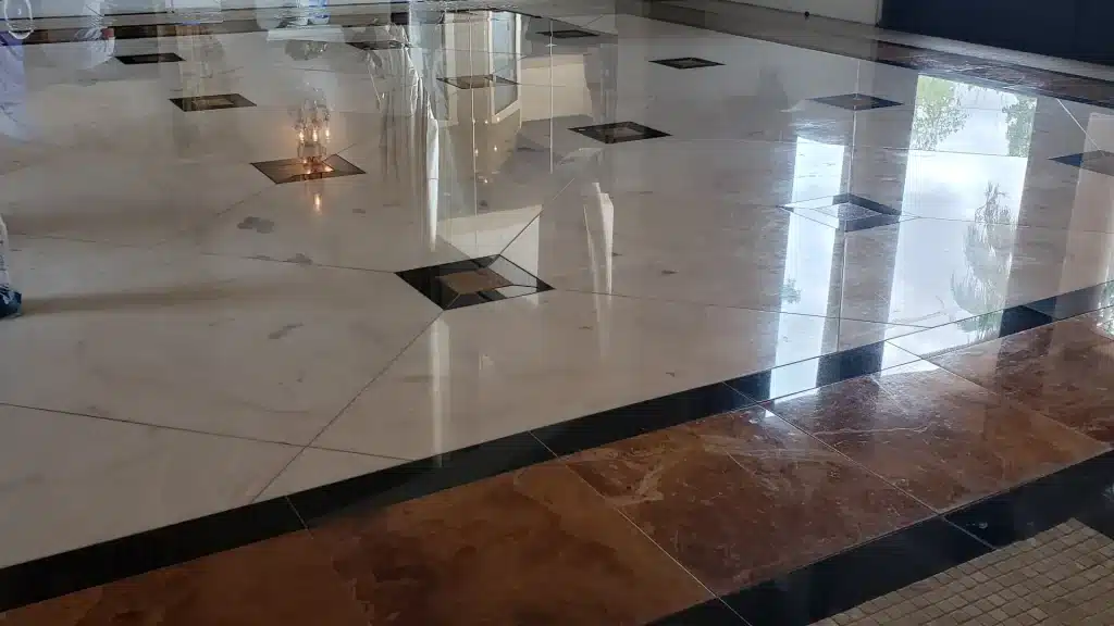 marble vs granite flooring comparison in luxury home interior