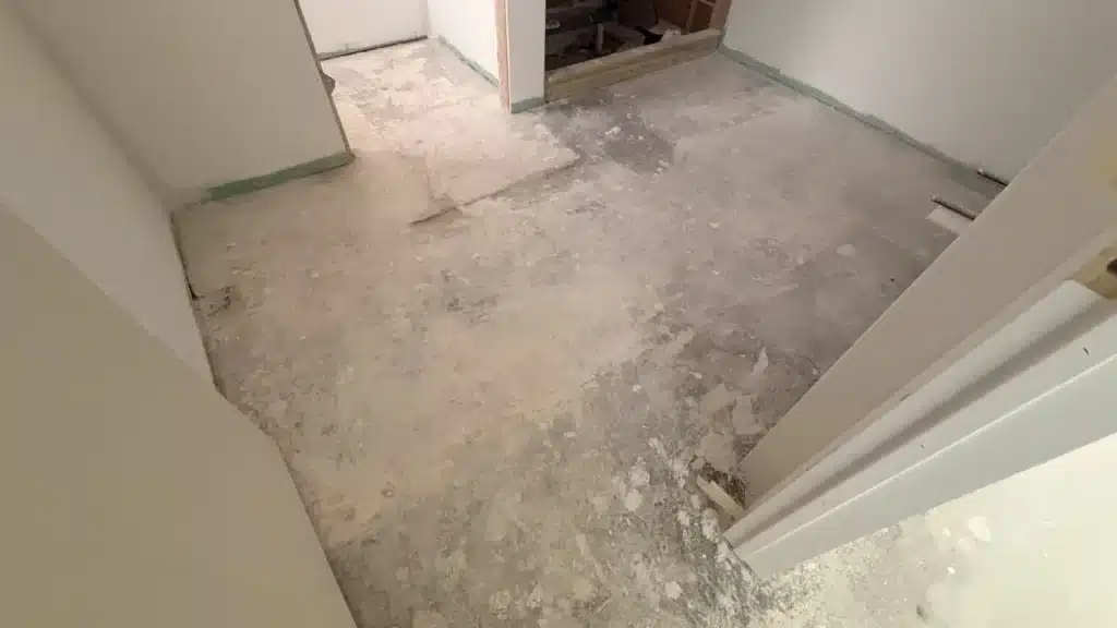 Damaged concrete floor before terrazzo installation in Houston TX showing uneven slab and surface imperfections