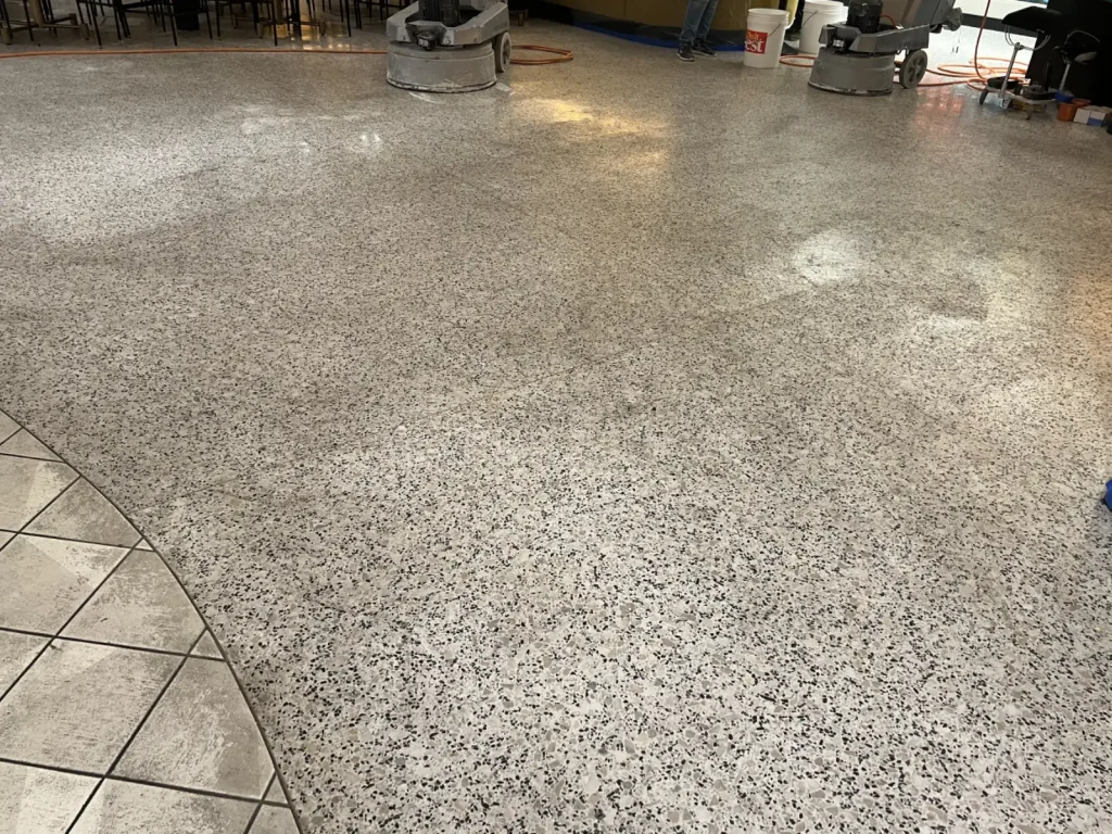 terrazzo coating cloudy uneven finish showing wear and loss of shine
